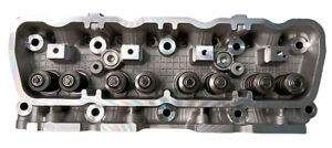 Nissan K21 K21 Reconditioned Cylinder Head - Midland Cylinder Heads Cylinder head of an inline engine with valve springs and cam components visible, viewed from above.
