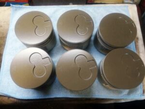 1HZ Toyota piston crowns with thermal barrier applied 1 - Midland Cylinder Heads 1hz toyota piston crowns with thermal barrier applied.